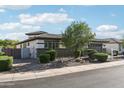 Charming single-story home featuring desert landscaping and a gated courtyard entrance at 3371 E Azalea Dr, Chandler, AZ 85286