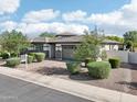 Attractive single-story home with well-manicured landscaping and a two-car garage at 3371 E Azalea Dr, Chandler, AZ 85286