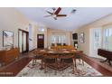 Open dining area with modern table set, seamless transition to living room, and good natural light at 506 W Sandra Ter, Phoenix, AZ 85023