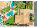 Aerial view of a home with a private pool, landscaped backyard, and a tile roof at 1150 W Sherri Dr, Gilbert, AZ 85233
