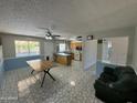 The spacious living room features tile floors and an open floorplan concept at 12836 N 39Th Ln, Phoenix, AZ 85029