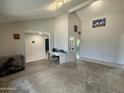 Bright living room boasts an open floor plan with a vaulted ceiling at 12836 N 39Th Ln, Phoenix, AZ 85029