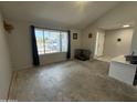 Bright living room with vaulted ceiling, large windows, and tile entryway at 12836 N 39Th Ln, Phoenix, AZ 85029
