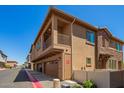 Charming two-story townhome showcasing a private balcony and attached garage at 4100 S Pinelake Way # 121, Chandler, AZ 85249