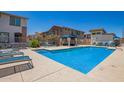 Community pool with lounge chairs, cabana and inviting cool water in an upscale neighborhood at 4100 S Pinelake Way # 121, Chandler, AZ 85249