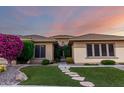 Attractive home with manicured lawn and stepping stone pathway to the entrance at 41715 N River Bend Rd, Phoenix, AZ 85086