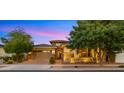 Charming home exterior featuring a brick facade, manicured landscaping, and a welcoming entrance at 4865 S Cylinder Way, Mesa, AZ 85212