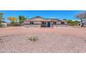 Inviting single-story home with desert landscaping and circular driveway, perfect for easy access and curb appeal at 6502 E Rustic Dr, Mesa, AZ 85215