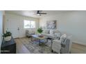 Comfortable living room featuring plush seating, contemporary decor, and plenty of natural light at 6502 E Rustic Dr, Mesa, AZ 85215