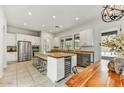 Spacious kitchen featuring a large island with seating, stainless steel appliances, and ample counter space at 9433 E Trailside Vw, Scottsdale, AZ 85255