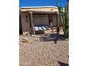 Relaxing porch swing with decorative pillows and landscaping at 2511 N 56Th St, Mesa, AZ 85215