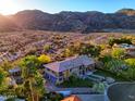 Desert mountain views surround this elegant home with an expansive driveway at 12240 S Honah Lee Ct, Phoenix, AZ 85044