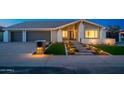 Inviting front entrance with a well-lit walkway, manicured lawn, and modern landscaping at 2178 E La Jolla Dr, Tempe, AZ 85282