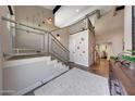 Foyer view features an open staircase, high ceilings, and hardwood floors throughout the home at 2308 E State Ave, Phoenix, AZ 85020