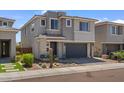 Beautiful home featuring a two-car garage and desert landscaping at 3131 E Tina Dr, Phoenix, AZ 85050
