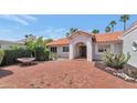 Beautiful home exterior featuring a red brick driveway and tiled entryway, surrounded by desert landscaping at 8666 E Cheryl Dr, Scottsdale, AZ 85258