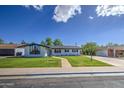 Charming single-story home with lush green lawn, walkway, and freshly painted exterior for great curb appeal at 1263 W Devonshire St, Mesa, AZ 85201