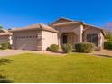 Well-kept single-story home with desert landscaping, a two-car garage, and a welcoming front lawn at 1463 W Mead Dr, Chandler, AZ 85248