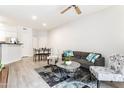 Contemporary living room with an open floor plan, stylish furniture, and seamless access to the dining area at 1701 E Colter St # 151, Phoenix, AZ 85016