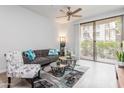 Inviting living room featuring a sliding glass door, comfortable seating, and tasteful contemporary decor at 1701 E Colter St # 151, Phoenix, AZ 85016