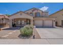 Charming two-story house with a well-kept lawn, a covered entrance, and a spacious three-car garage at 2911 W Keim Dr, Phoenix, AZ 85017
