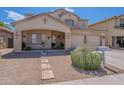 Attractive two-story house with a covered entry, a landscaped front yard, and a convenient three-car garage at 2911 W Keim Dr, Phoenix, AZ 85017