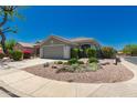 Well-manicured front yard with desert landscaping leading to a cozy single-story home at 30440 N 42Nd Pl, Cave Creek, AZ 85331