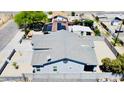 An elevated aerial view of the home showing the roof line, solar panels, and neighborhood at 32101 W Palo Verde St, Wittmann, AZ 85361