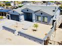 Beautiful one-story home with gray accent trim and an attractive landscaped front yard, featuring an attached garage at 32101 W Palo Verde St, Wittmann, AZ 85361