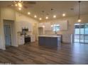 Bright, open kitchen with white cabinets, stainless steel appliances, and a large center island at 350 N Florence St, Florence, AZ 85132