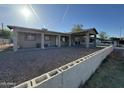 Charming single-story home with a covered parking and desert landscaping in the front yard at 3806 N 80Th Dr, Phoenix, AZ 85033