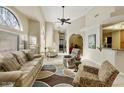 Spacious living area featuring large windows, high ceilings, tile floors, and comfortable seating at 4202 E Broadway Rd # 40, Mesa, AZ 85206