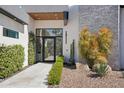Stunning front entrance featuring a modern design, desert landscaping, and a welcoming walkway at 4502 E Solano Dr, Phoenix, AZ 85018