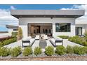 Beautiful outdoor patio featuring comfortable seating and a modern fire pit, perfect for entertaining guests at 4502 E Solano Dr, Phoenix, AZ 85018