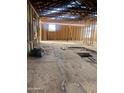 View of the home's interior showing the stud framing and window placement at 509 W 12Th St, Casa Grande, AZ 85122