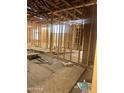 View of the home's interior showing subfloor, stud framing and construction materials at 509 W 12Th St, Casa Grande, AZ 85122