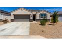 Inviting home featuring a well-manicured front yard and a convenient two-car garage at 5146 E Diatomite Dr, San Tan Valley, AZ 85143