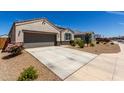 Attractive home with a long driveway, desert landscaping, and a charming front entrance at 5146 E Diatomite Dr, San Tan Valley, AZ 85143
