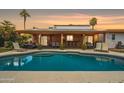 Beautiful backyard pool with outdoor seating and covered patio, perfect for relaxing and entertaining at 6611 E Voltaire Ave, Scottsdale, AZ 85254