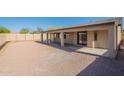 Spacious backyard with a gravel ground cover, and a covered patio perfect for enjoying outdoor living at 7516 W Mary Jane Ln, Peoria, AZ 85382