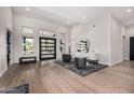 Bright living room with hardwood floors and lots of natural light at 9627 E Adobe Dr, Scottsdale, AZ 85255