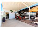 RV parking features a covered patio area, outdoor seating, privacy fence, and connection to the RV at 111 S Greenfield Rd # 784, Mesa, AZ 85206