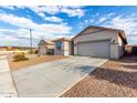 This home boasts a long driveway and convenient two-car garage at 11505 W Boca Raton Rd, El Mirage, AZ 85335