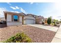 View of a cozy single-story home featuring low maintenance landscaping at 11505 W Boca Raton Rd, El Mirage, AZ 85335