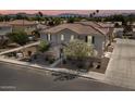 Aerial view of a two-story home with a tile roof, manicured desert landscaping, and a private entrance at 1317 N Balboa --, Mesa, AZ 85205