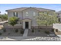 Two-story home featuring a tile roof, neutral stucco exterior, and low-maintenance landscaping at 1317 N Balboa --, Mesa, AZ 85205