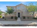Attractive two-story home with desert landscaping, neutral colors, and a welcoming front entry at 1317 N Balboa --, Mesa, AZ 85205