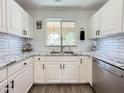 Bright kitchen featuring white cabinets, granite countertops, and stainless steel appliances at 1462 E Poncho Ln, San Tan Valley, AZ 85143