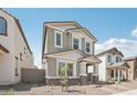 Charming two-story home with gray stucco, stone accents, and a welcoming front porch at 1913 W Lariat Ln, Phoenix, AZ 85085