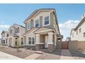 Charming two-story home with gray stucco, stone accents, and a welcoming front porch at 1913 W Lariat Ln, Phoenix, AZ 85085
